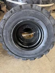 33X15.50-16.5 Used Otr Air Filled Tire On Jlg 9 Bolt Wheel, 0257756, 0257755. Fixed Price $219.00.